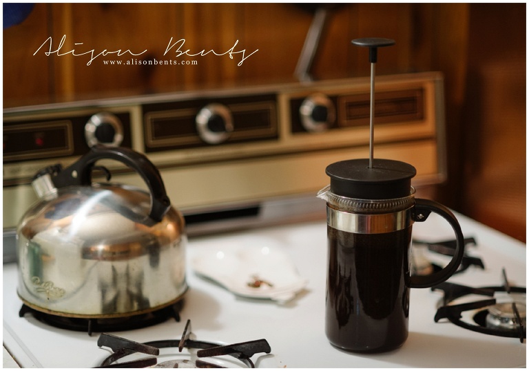 french press on stove with kettle