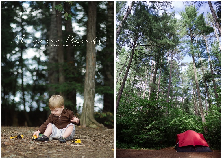 boy playing with trucks in woods, tent among trees