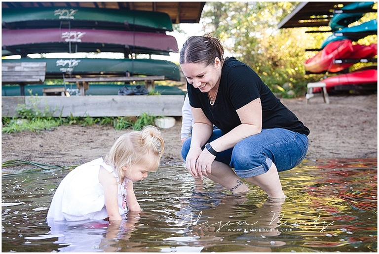 mom and daughter play in water