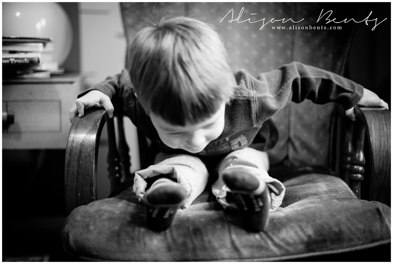 boy rocks himself on rocking chair | www.alisonbents.com